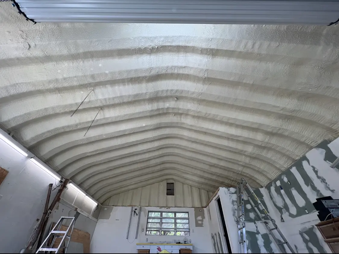 Spray polyurethane foam applied to the underside of a metal roof deck in Mount Airy